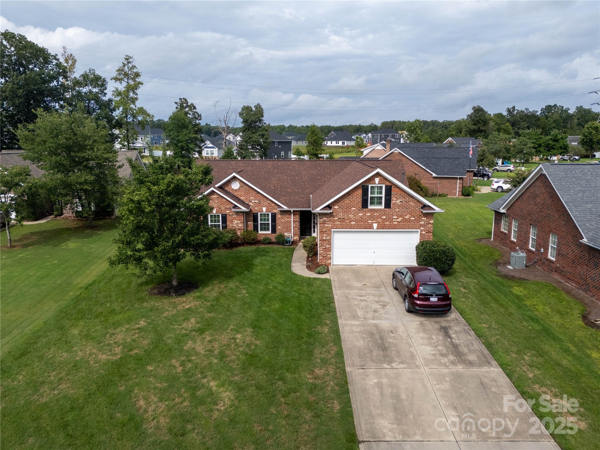 12617 Hill Pine Road Midland, NC 28107 - Photo 42 of 42 an aerial view of residential houses with outdoor space and trees
