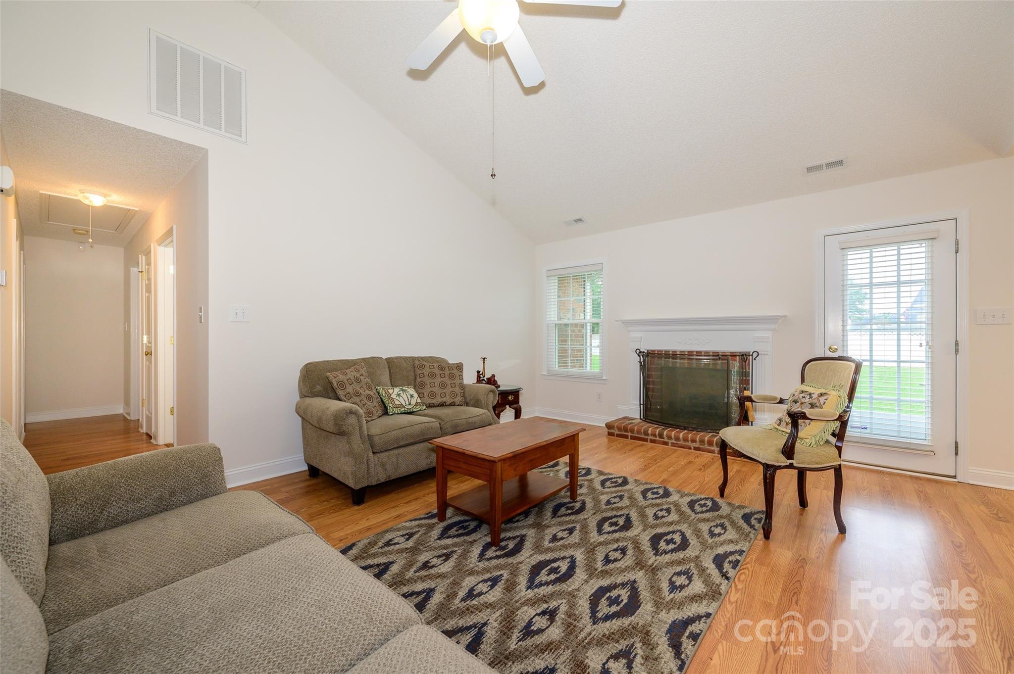 12617 Hill Pine Road Midland, NC 28107 - Photo 5 of 42 a living room with furniture and a fireplace