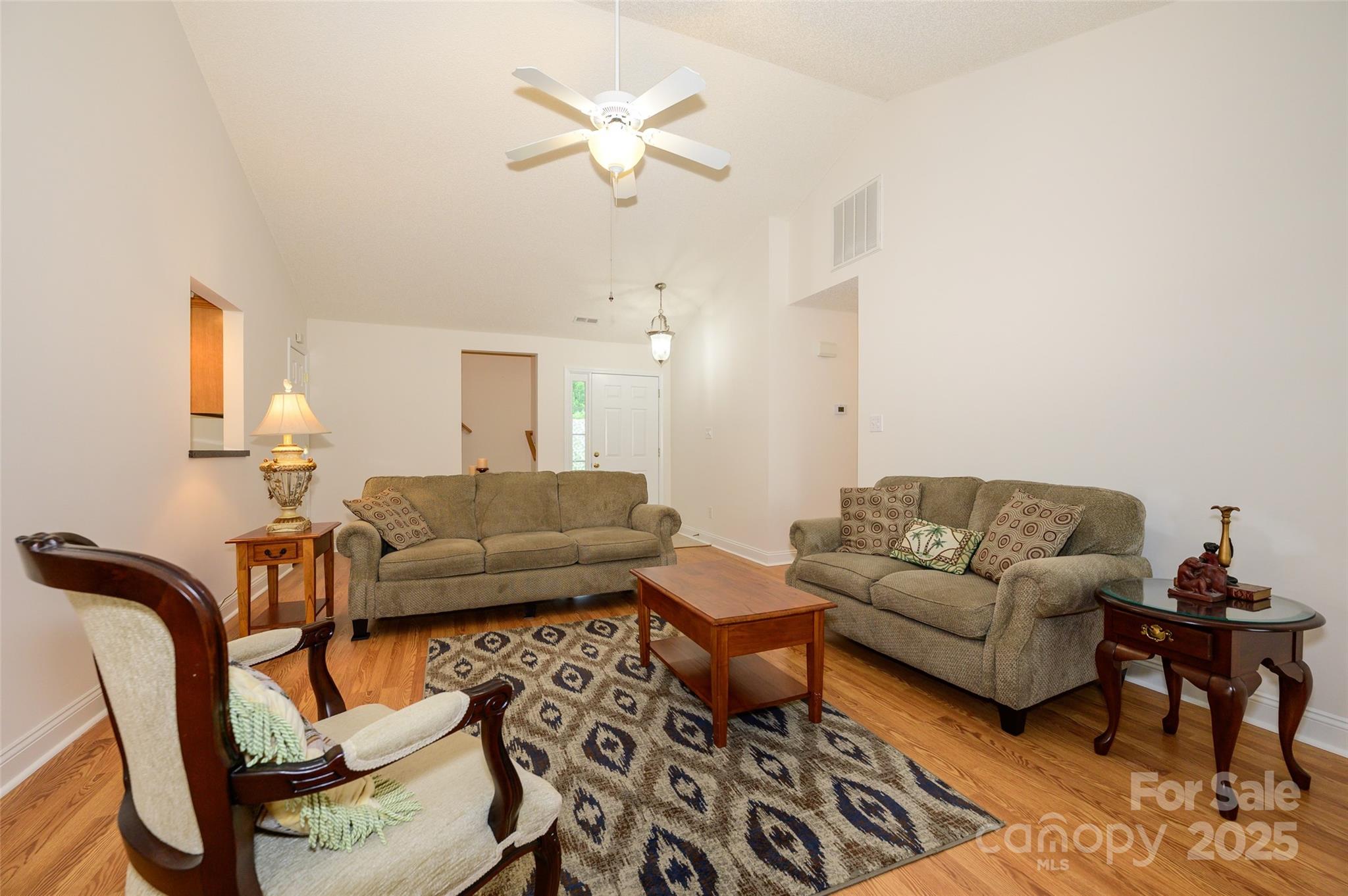 12617 Hill Pine Road Midland, NC 28107 - Photo 7 of 42 a living room with furniture a ceiling fan and a rug