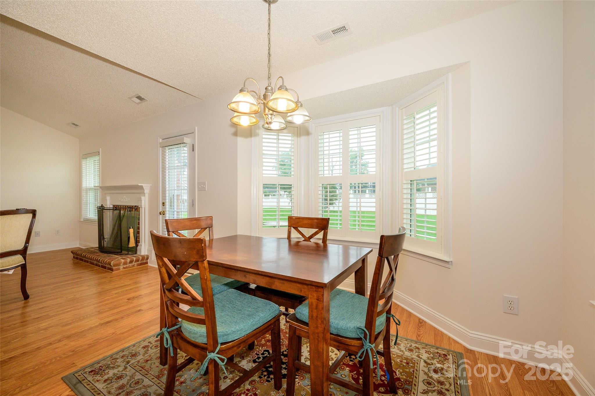 12617 Hill Pine Road Midland, NC 28107 - Photo 10 of 42 a view of a dining room with furniture window and wooden floor