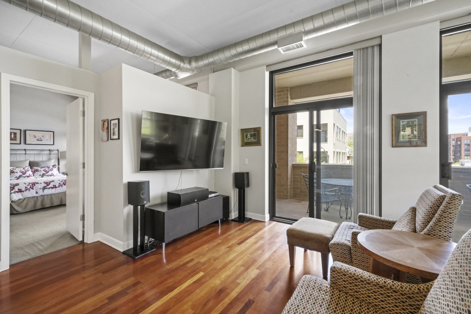 1301 West Madison Street, Unit 308 Chicago, IL 60607 - Photo 5 of 21 a living room with furniture and a flat screen tv
