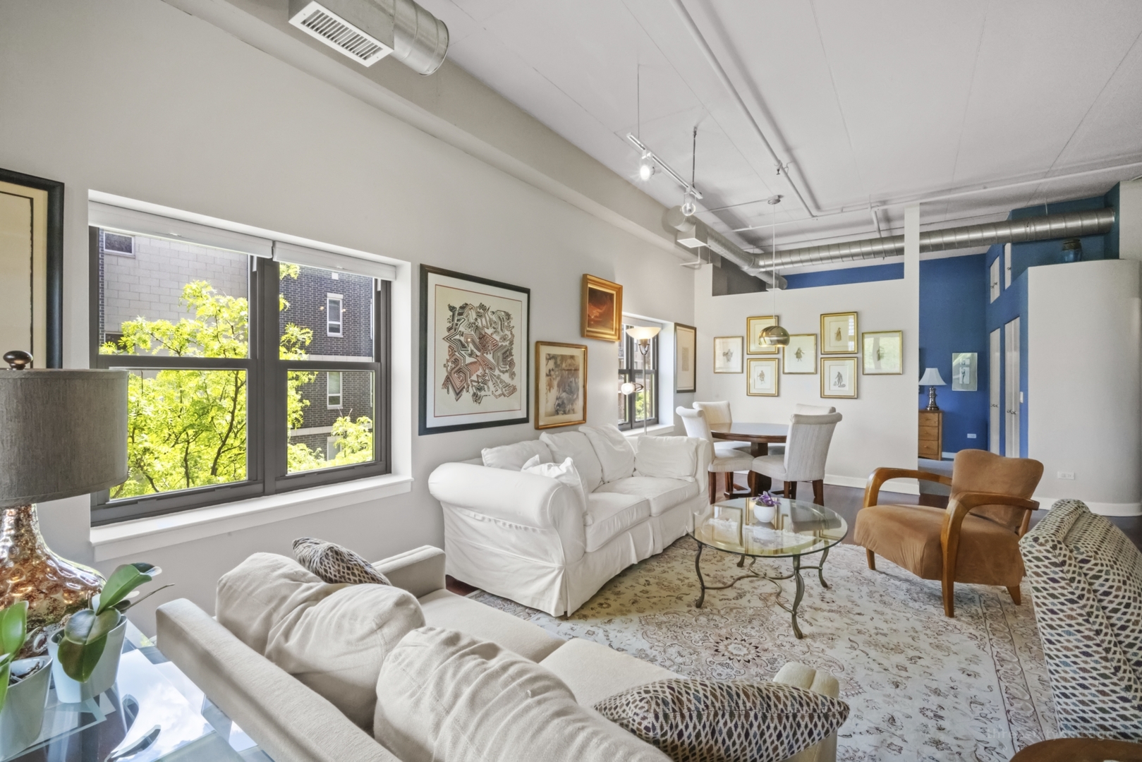 1301 West Madison Street, Unit 308 Chicago, IL 60607 - Photo 7 of 21 a living room with furniture and a large window