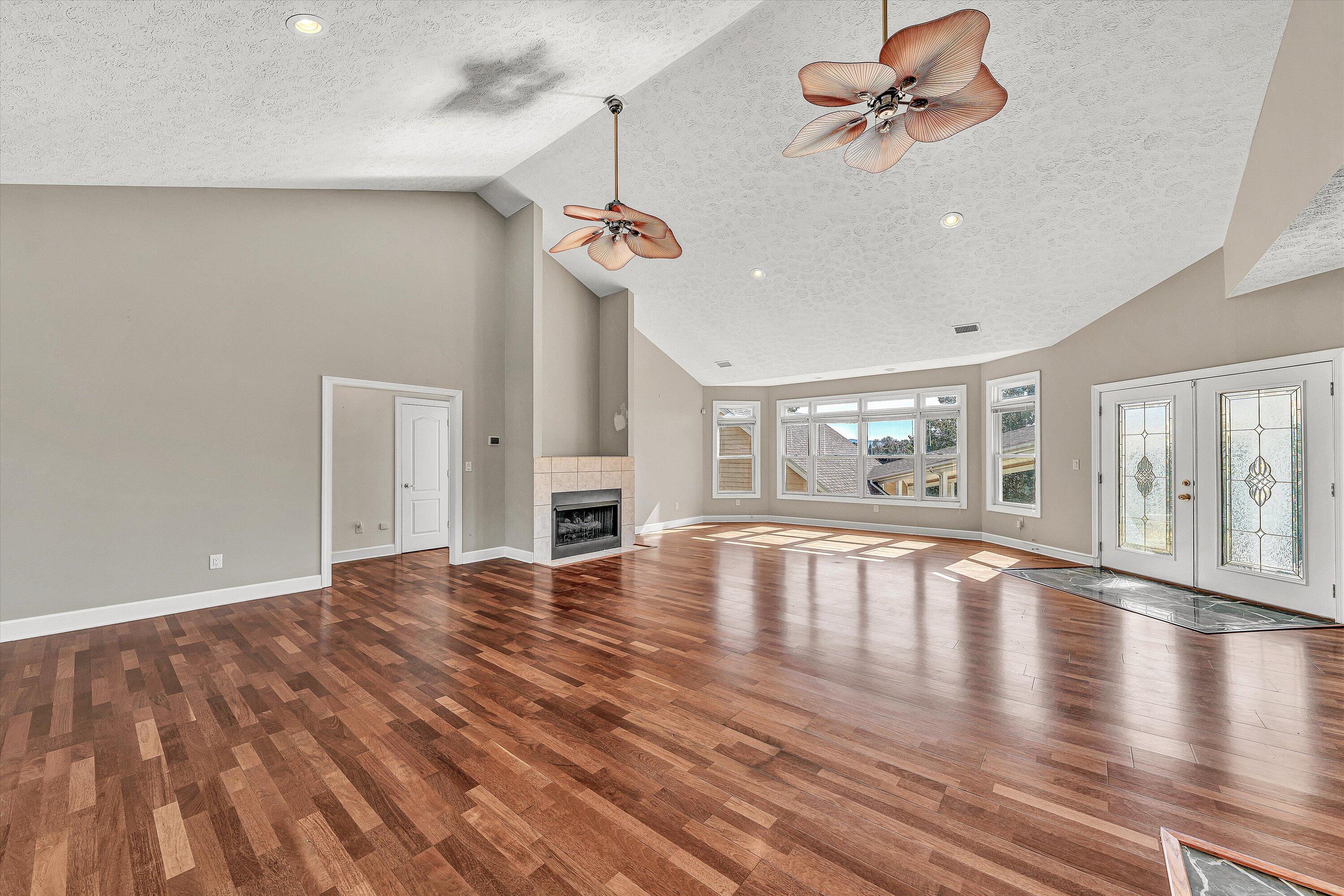 537 Calypso Road Moneta, VA 24121 - Photo 11 of 55 a view of empty room with wooden floor and fan