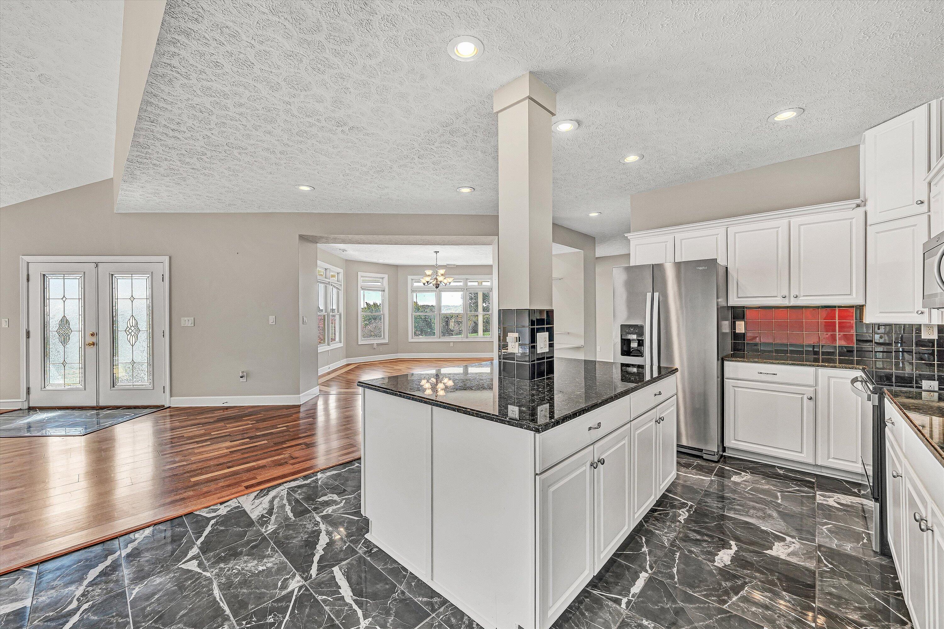 537 Calypso Road Moneta, VA 24121 - Photo 17 of 55 a kitchen with stainless steel appliances granite countertop a sink and cabinets