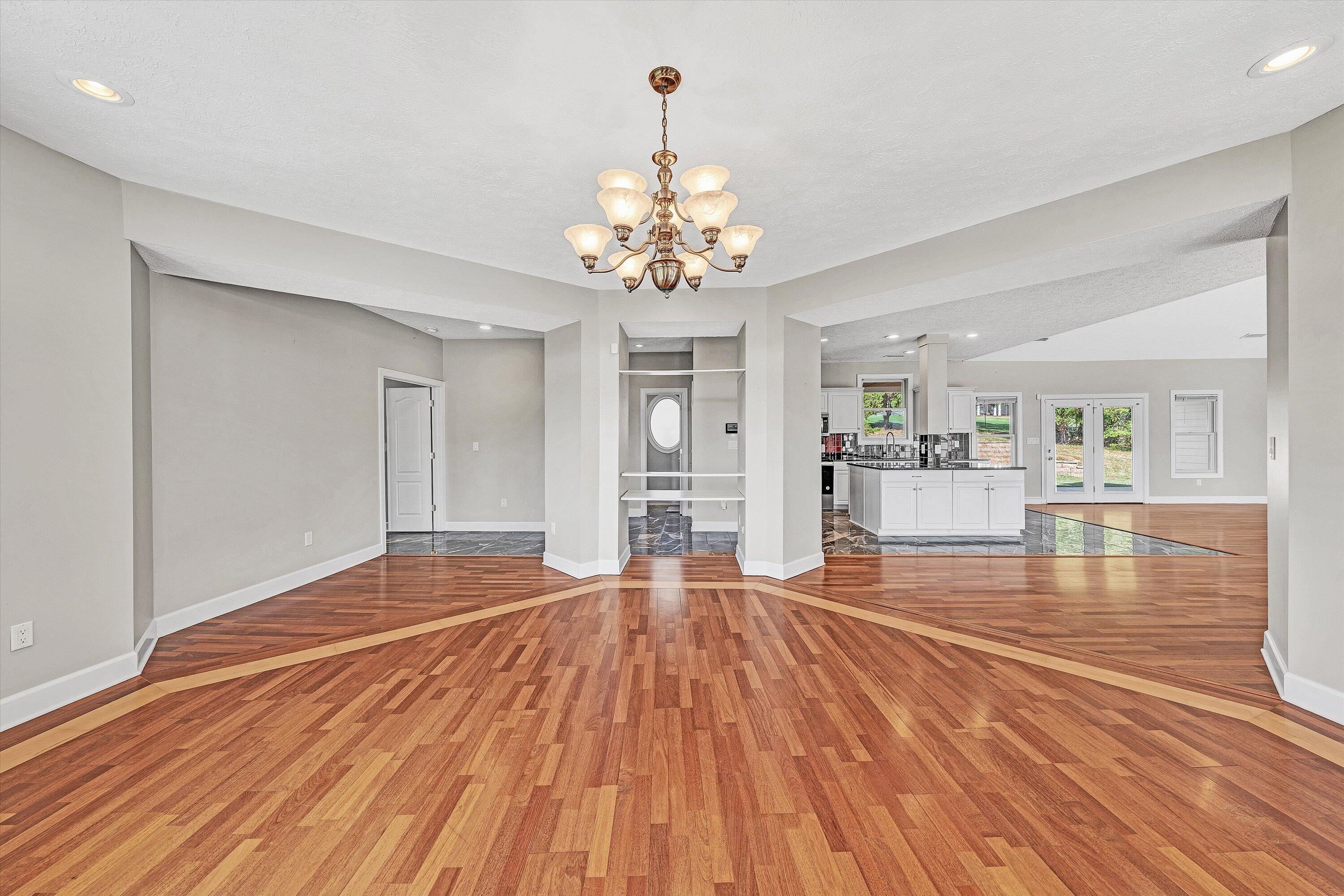 537 Calypso Road Moneta, VA 24121 - Photo 21 of 55 a view of a livingroom with wooden floor and a kitchen