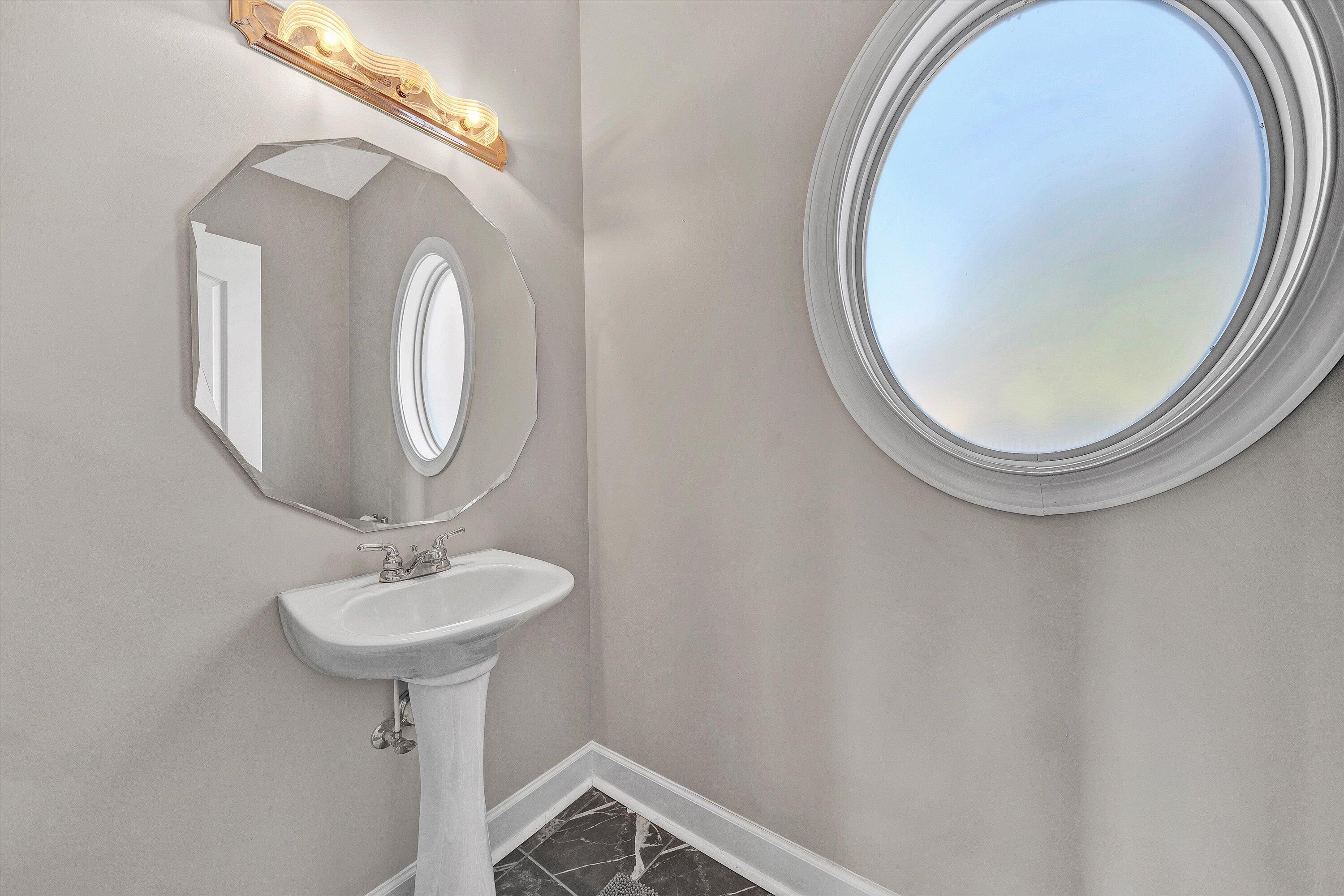 537 Calypso Road Moneta, VA 24121 - Photo 23 of 55 a bathroom with a sink and a mirror