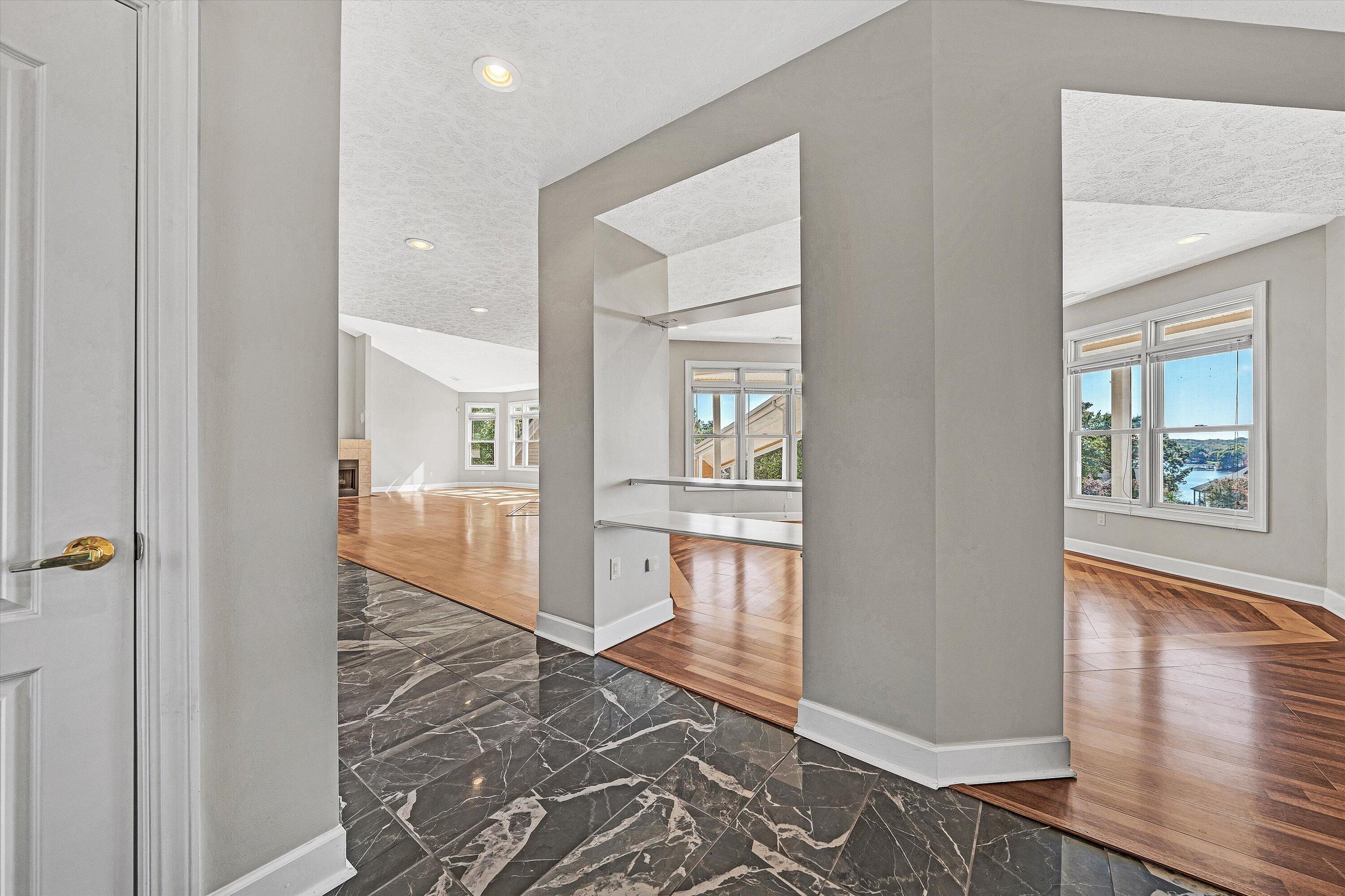 537 Calypso Road Moneta, VA 24121 - Photo 25 of 55 a view of a hallway with wooden floor windows and livingroom