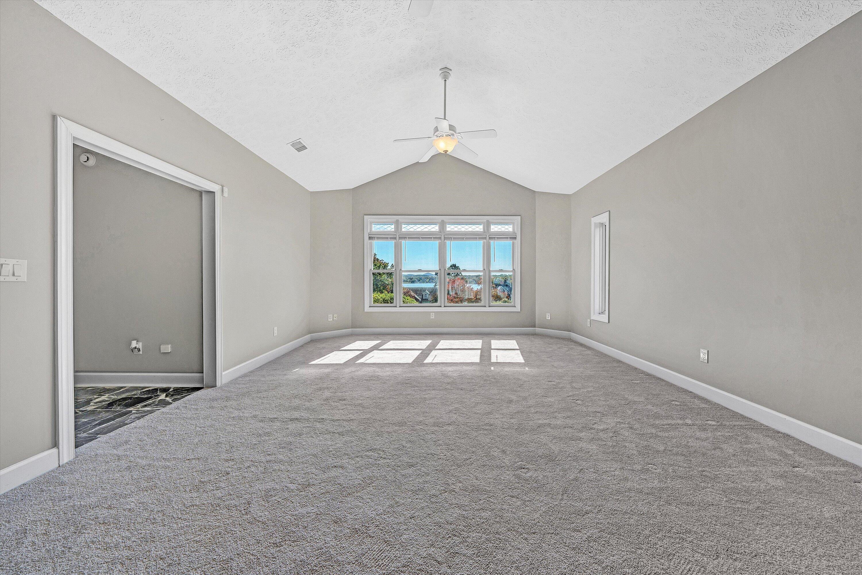 537 Calypso Road Moneta, VA 24121 - Photo 27 of 55 an empty room with windows and entrance