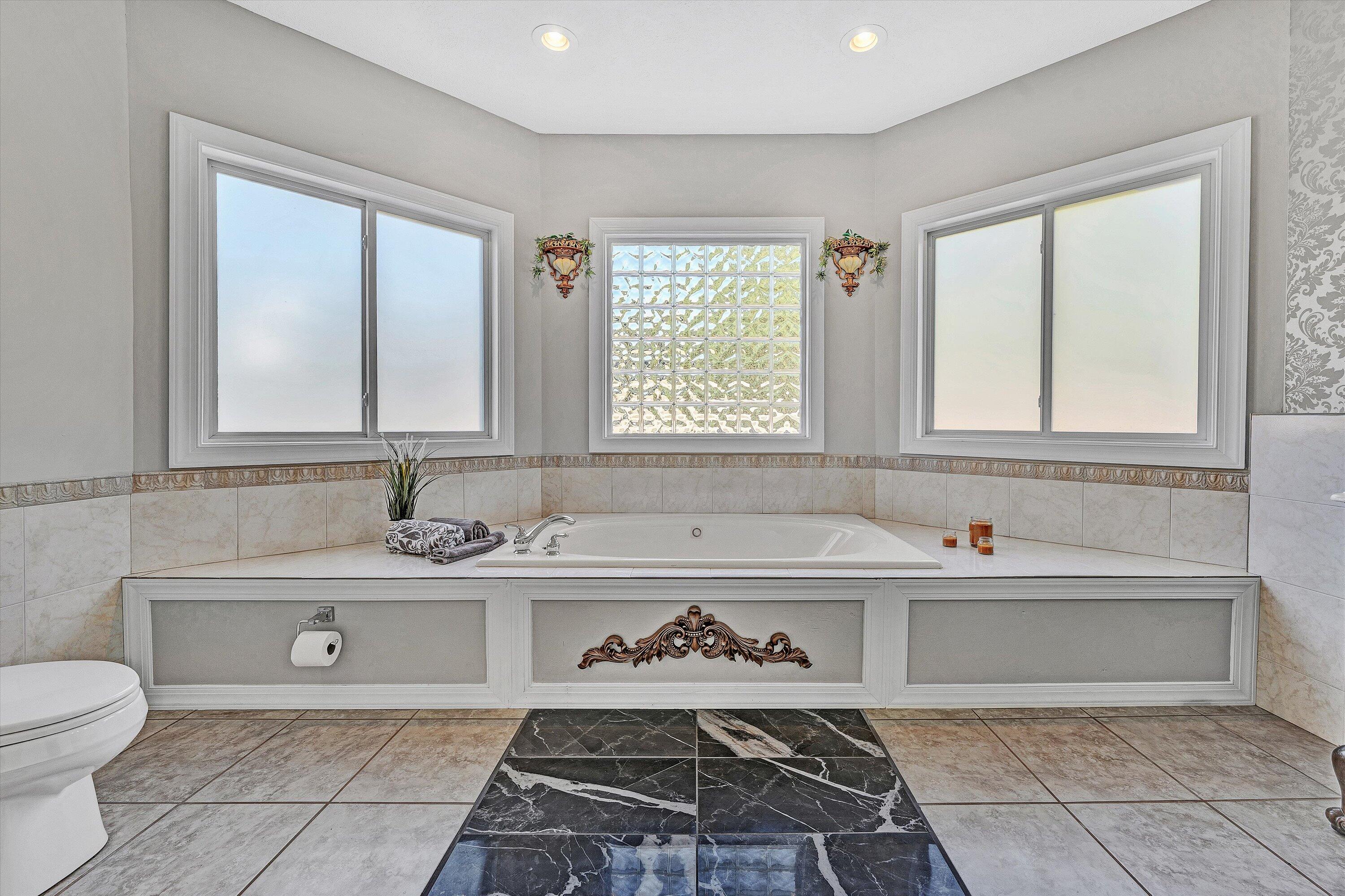 537 Calypso Road Moneta, VA 24121 - Photo 29 of 55 a bathroom with a bathtub sink and toilet