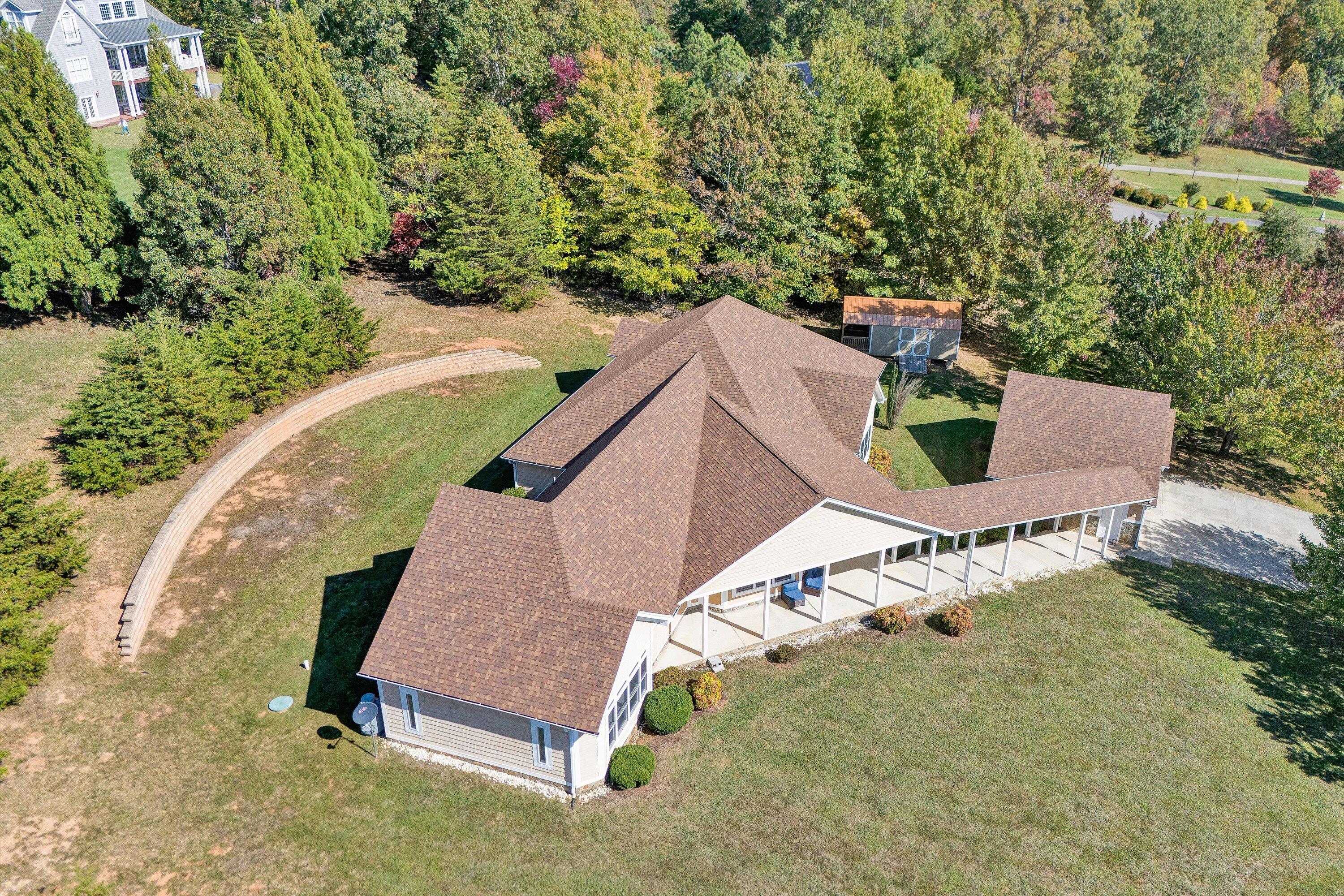 537 Calypso Road Moneta, VA 24121 - Photo 3 of 55 an aerial view of a house with a yard and lake