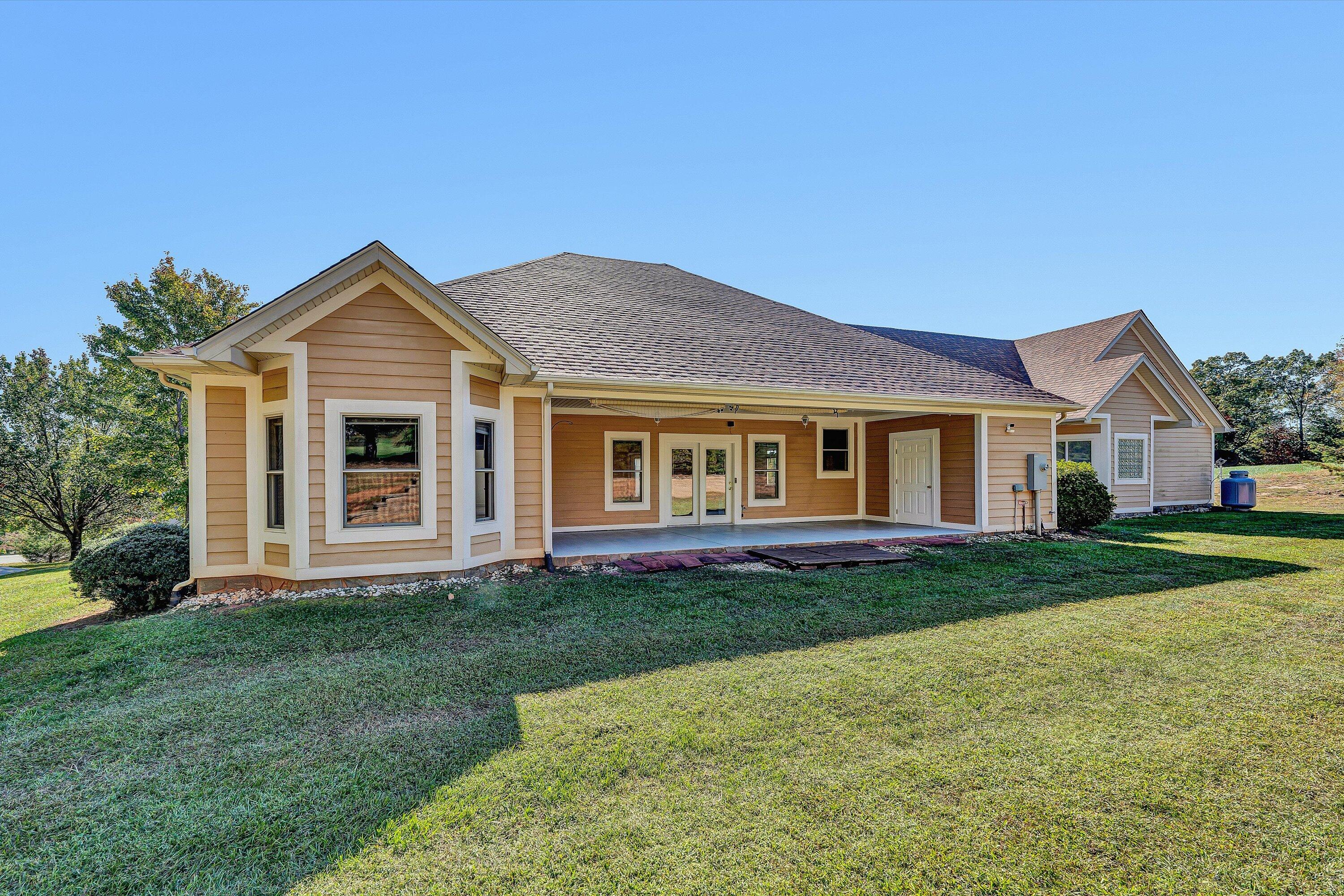 537 Calypso Road Moneta, VA 24121 - Photo 40 of 55 a front view of a house with a garden