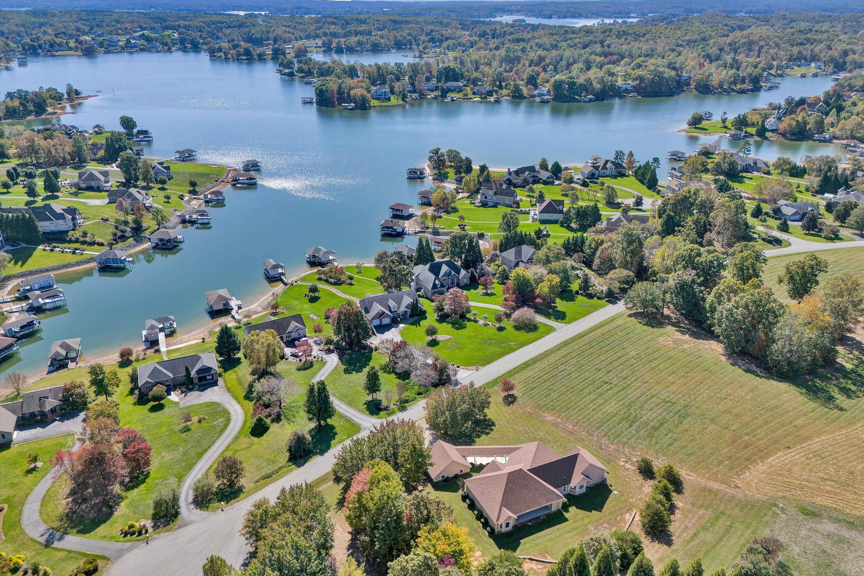 537 Calypso Road Moneta, VA 24121 - Photo 49 of 55 an aerial view of lake houses and covered with trees