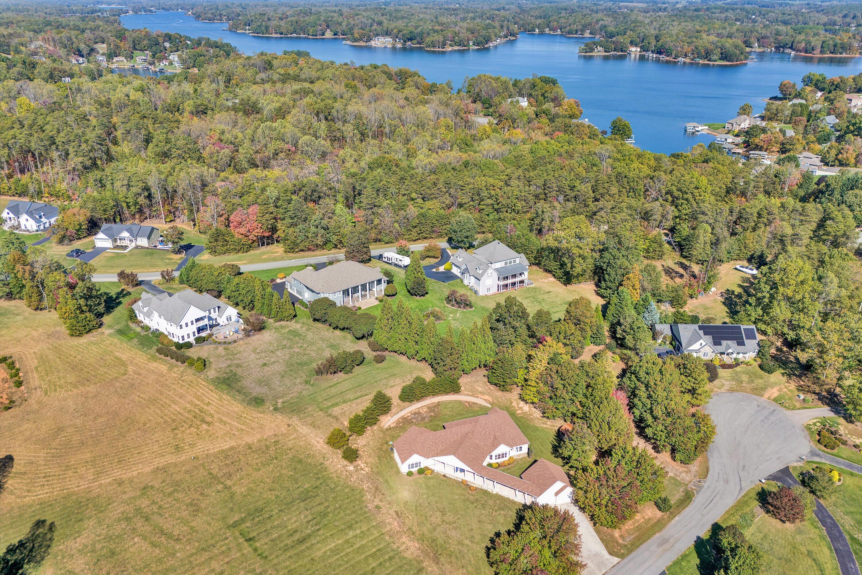 537 Calypso Road Moneta, VA 24121 - Photo 51 of 55 a view of a lake with houses in the back