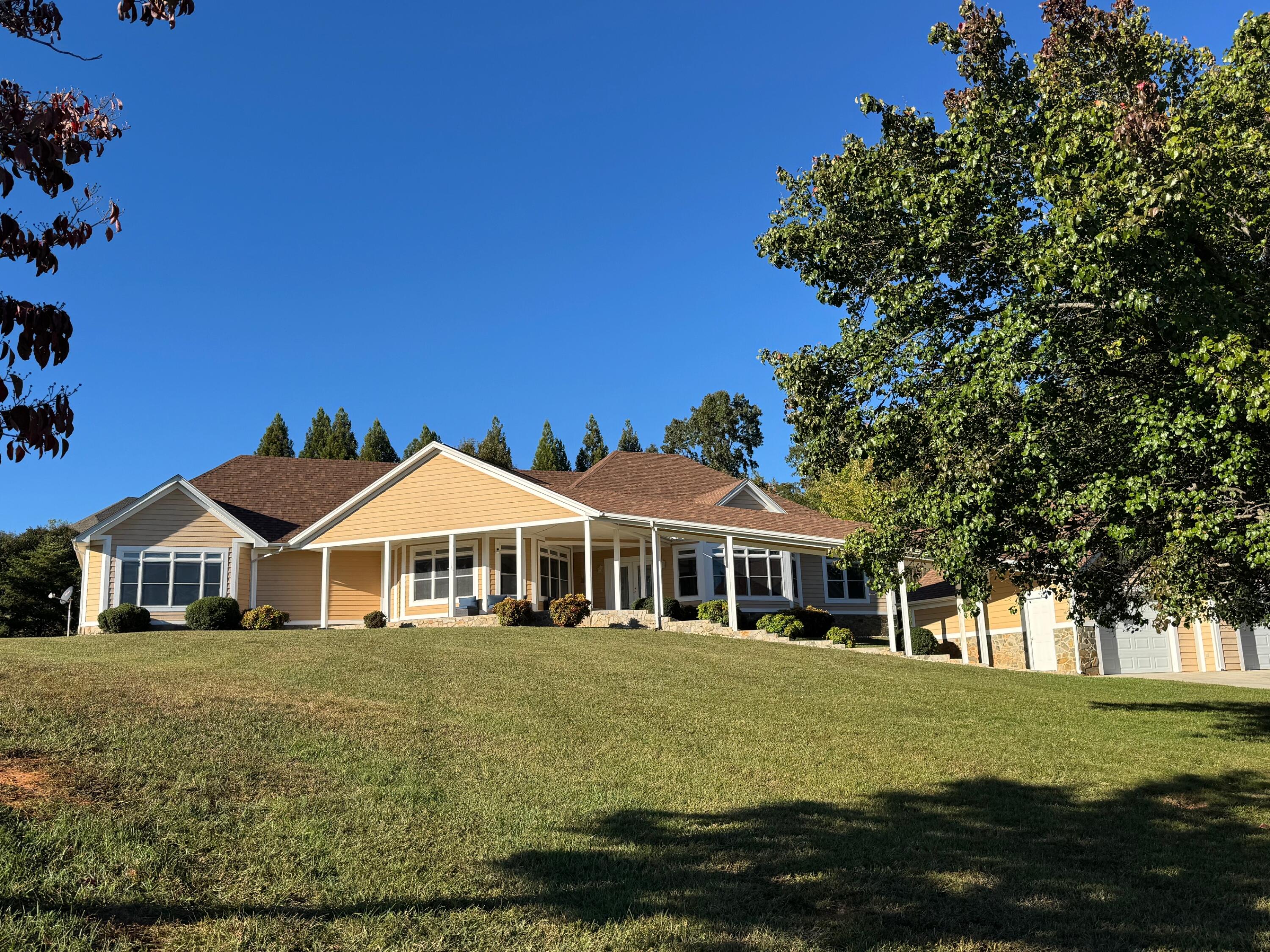 537 Calypso Road Moneta, VA 24121 - Photo 53 of 55 a front view of a house with a garden