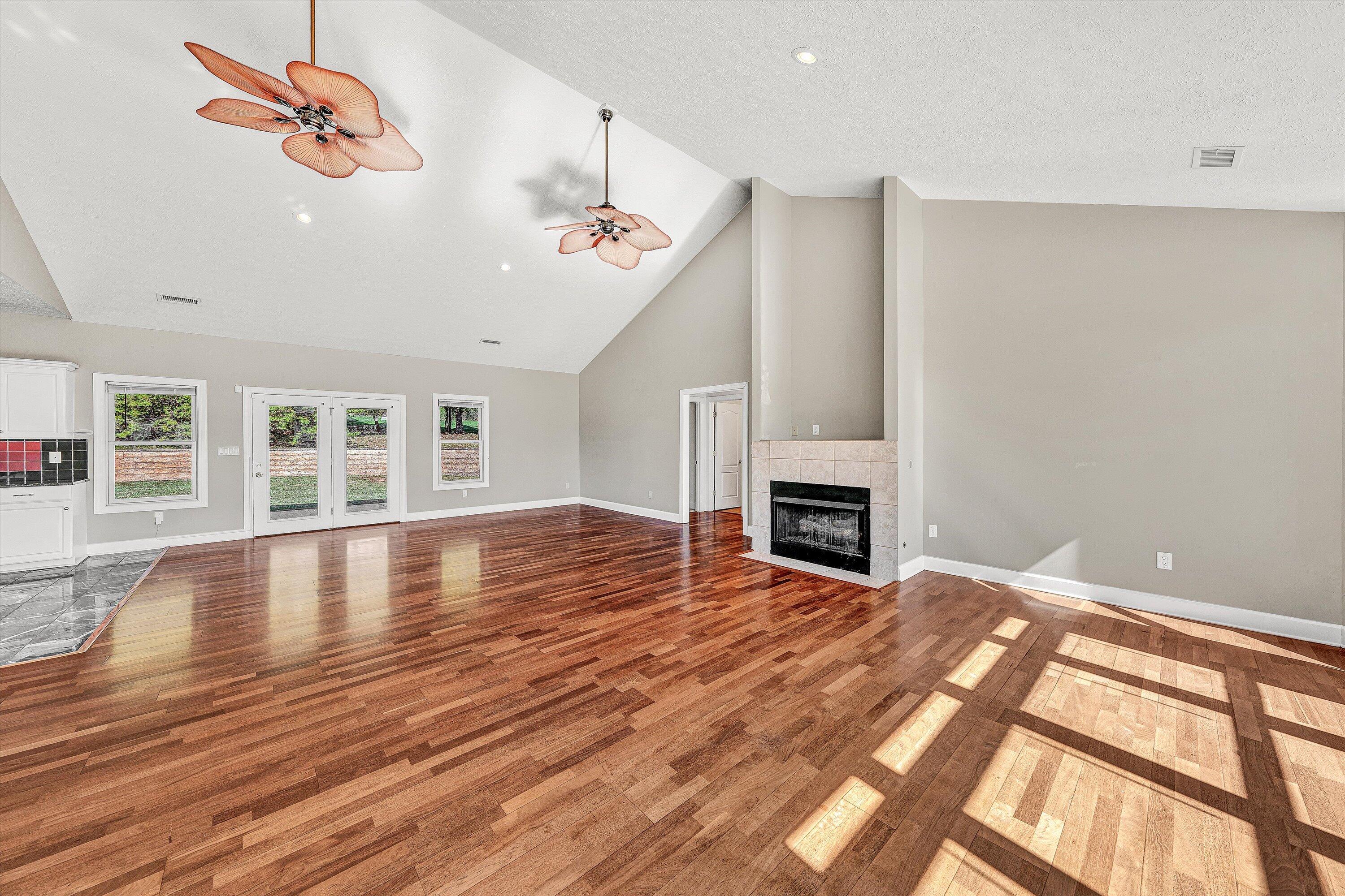 537 Calypso Road Moneta, VA 24121 - Photo 10 of 55 a view of empty room with wooden floor and fireplace