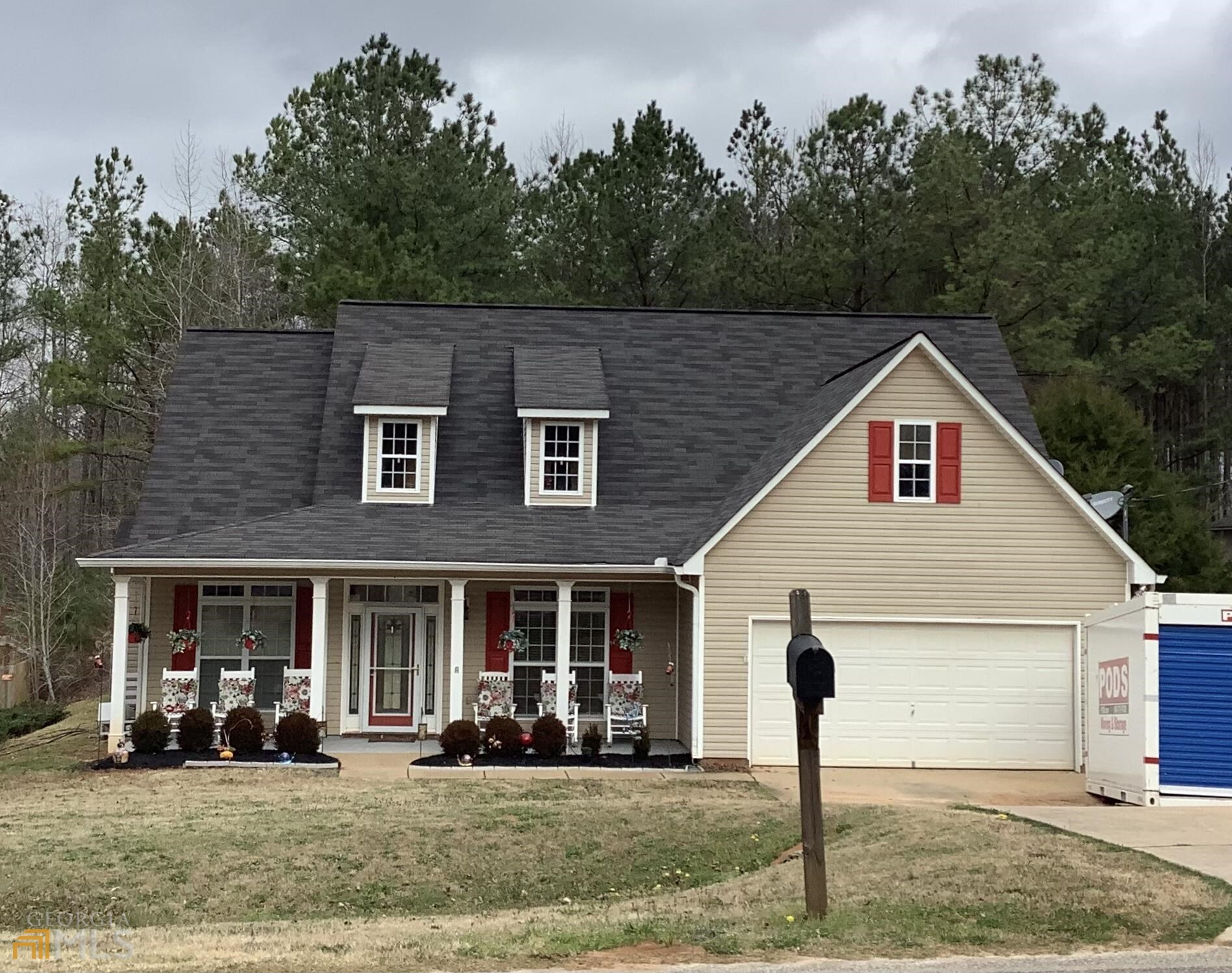 a front view of a house with garden