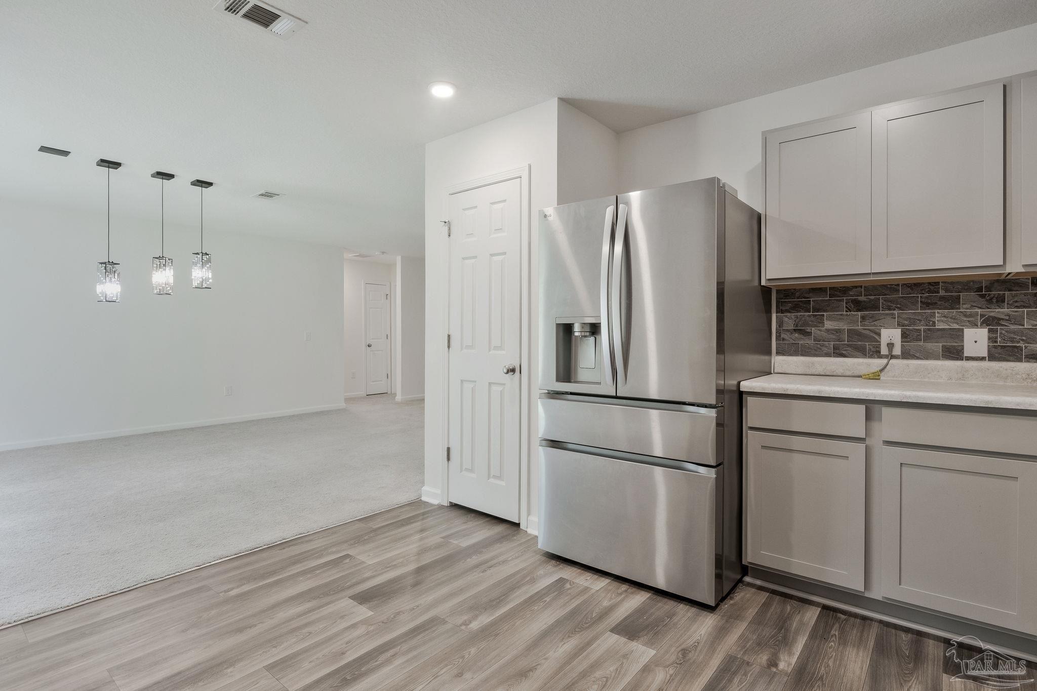 1625 Addies Way Pensacola, FL 32534 - Photo 20 of 50 a kitchen with stainless steel appliances a refrigerator and a sink