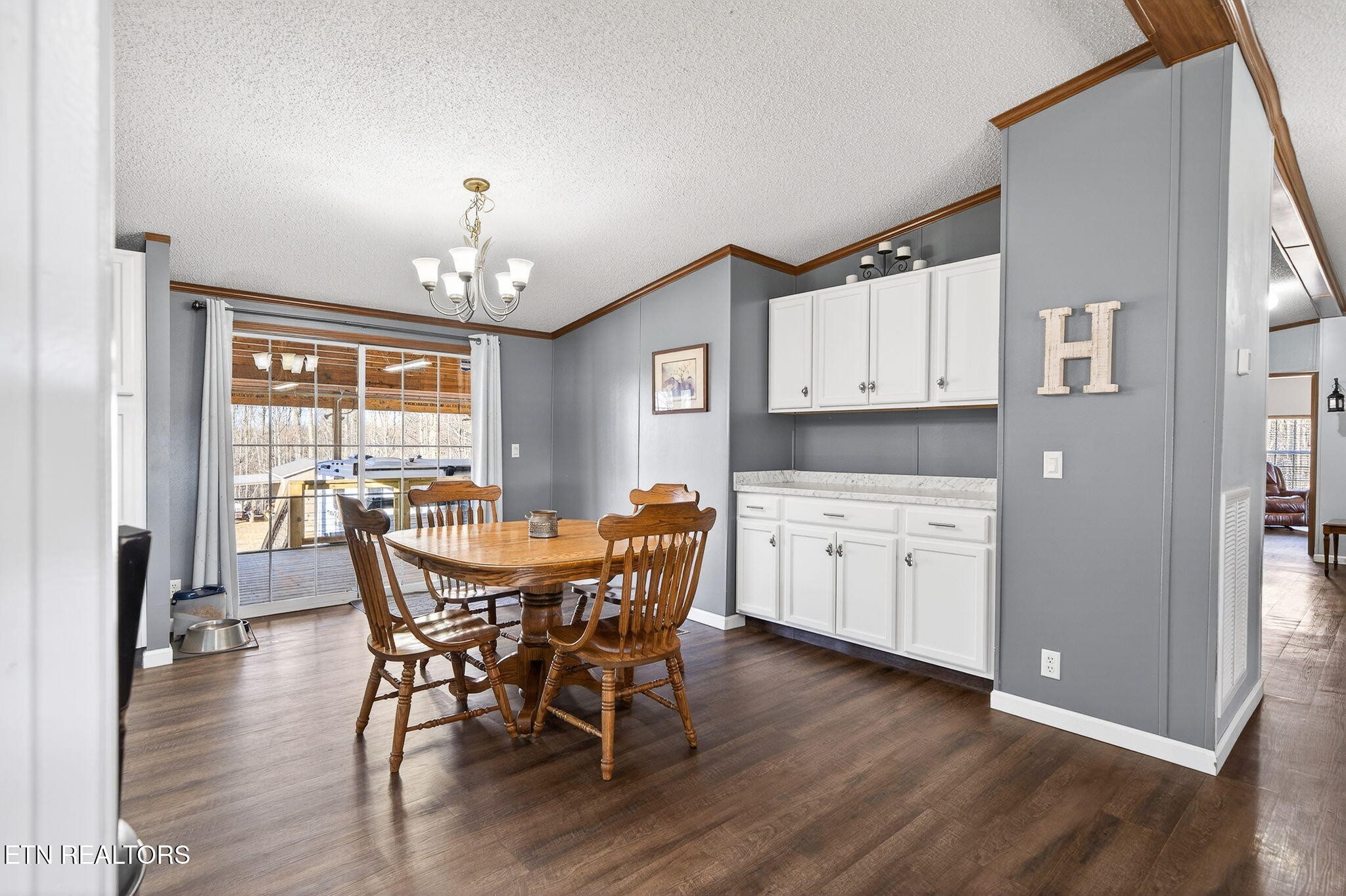 3773 Glade Creek Road Sparta, TN 38583 - Photo 14 of 59 a view of a dining room with furniture window and wooden floor