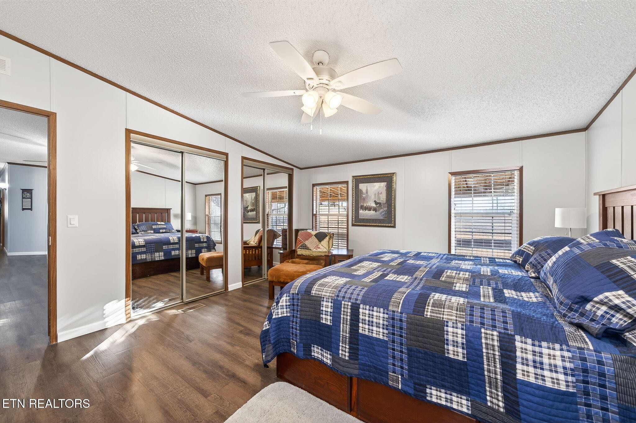 3773 Glade Creek Road Sparta, TN 38583 - Photo 16 of 59 a bedroom with a large bed and a chandelier