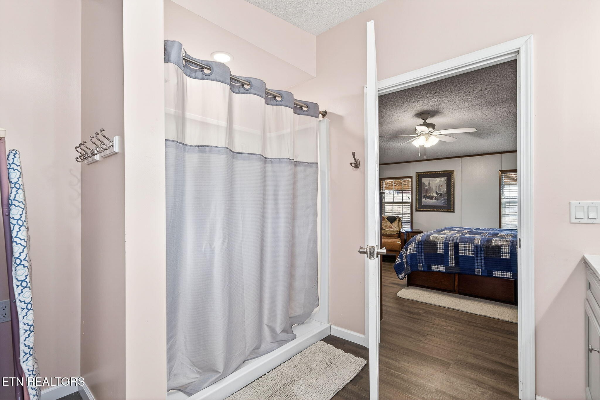 3773 Glade Creek Road Sparta, TN 38583 - Photo 19 of 59 a bedroom with a bed and a chandelier