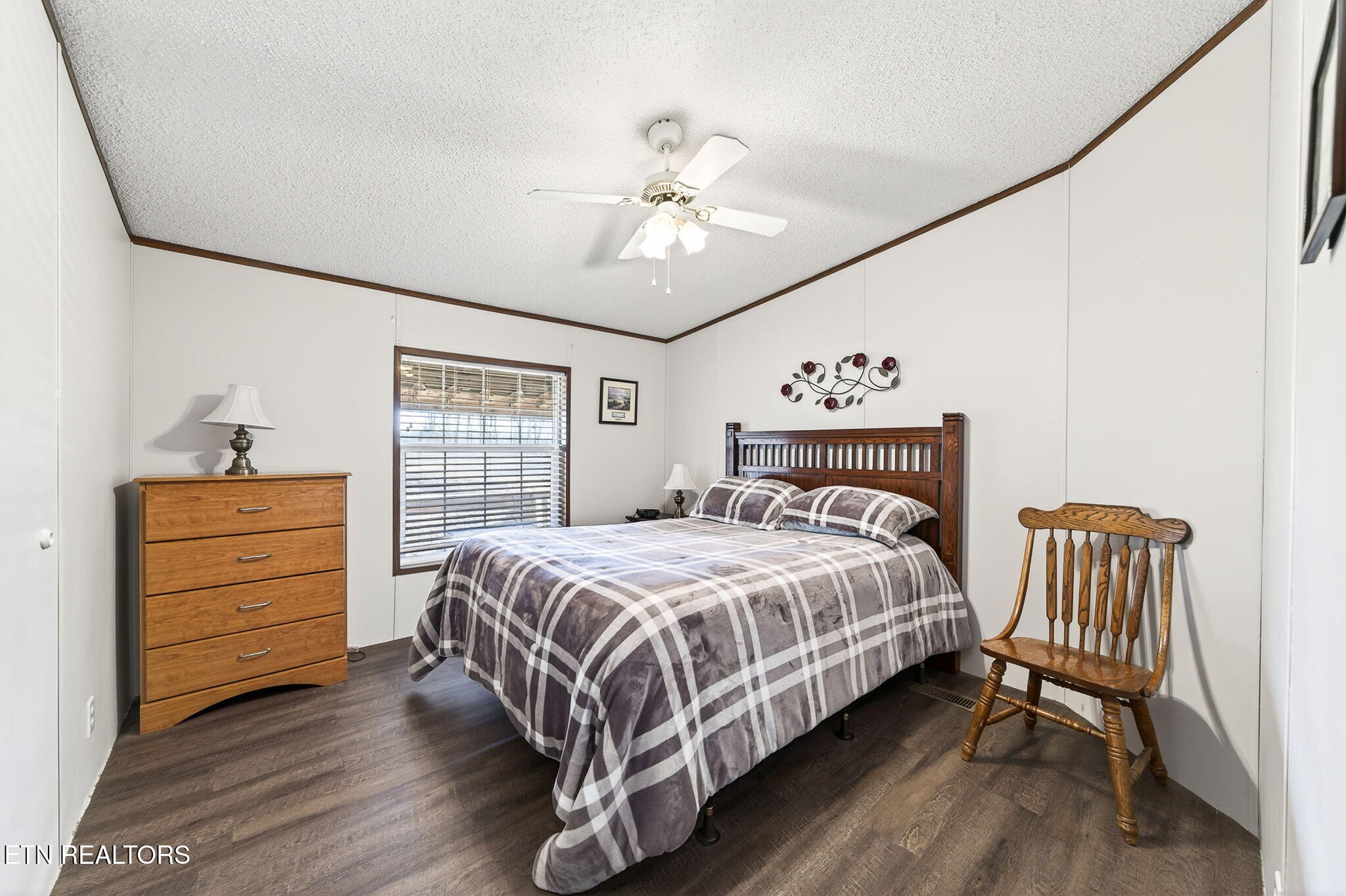 3773 Glade Creek Road Sparta, TN 38583 - Photo 21 of 59 a bedroom with a bed and a chandelier