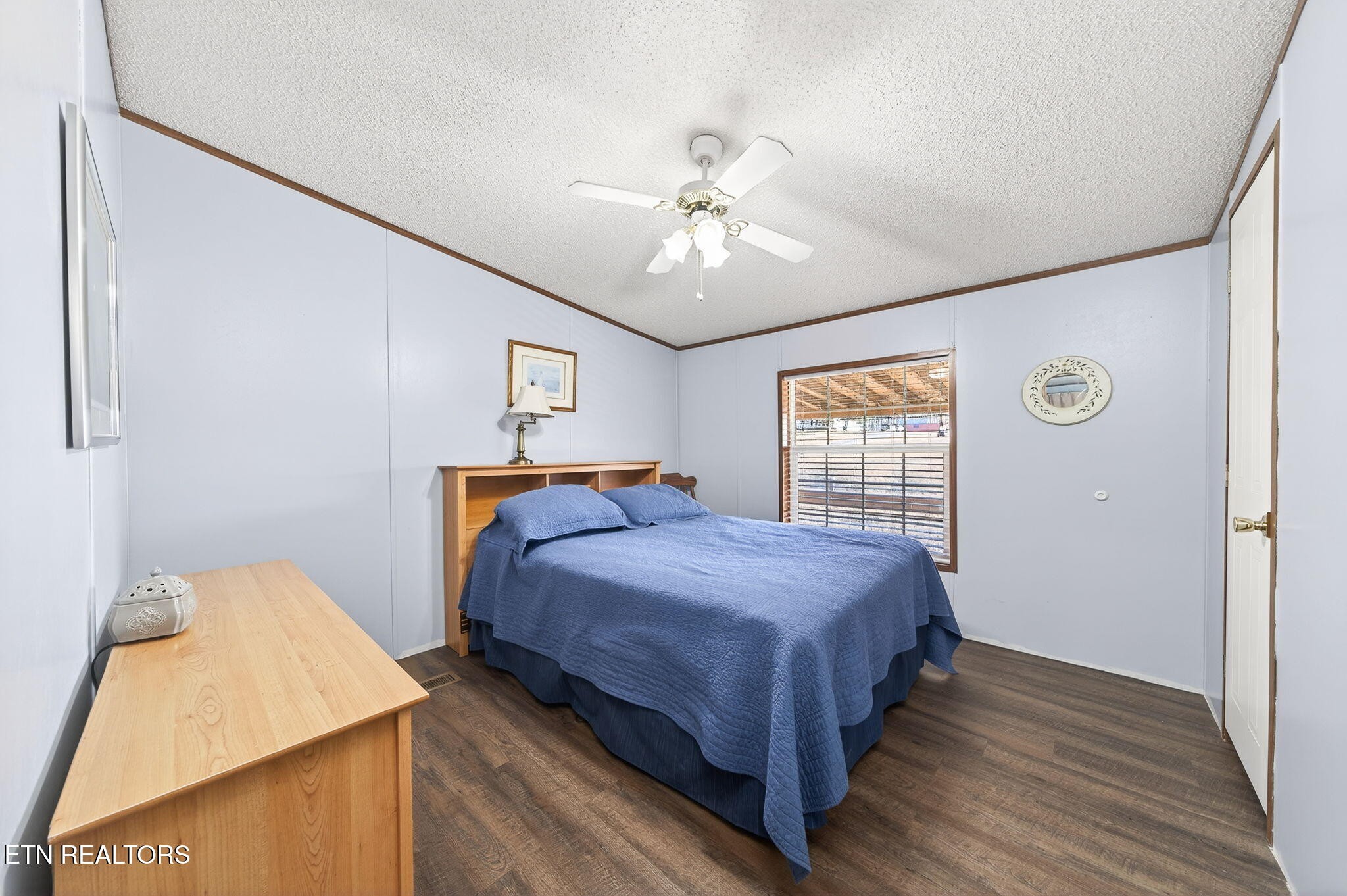 3773 Glade Creek Road Sparta, TN 38583 - Photo 22 of 59 a bedroom with a bed and a chandelier