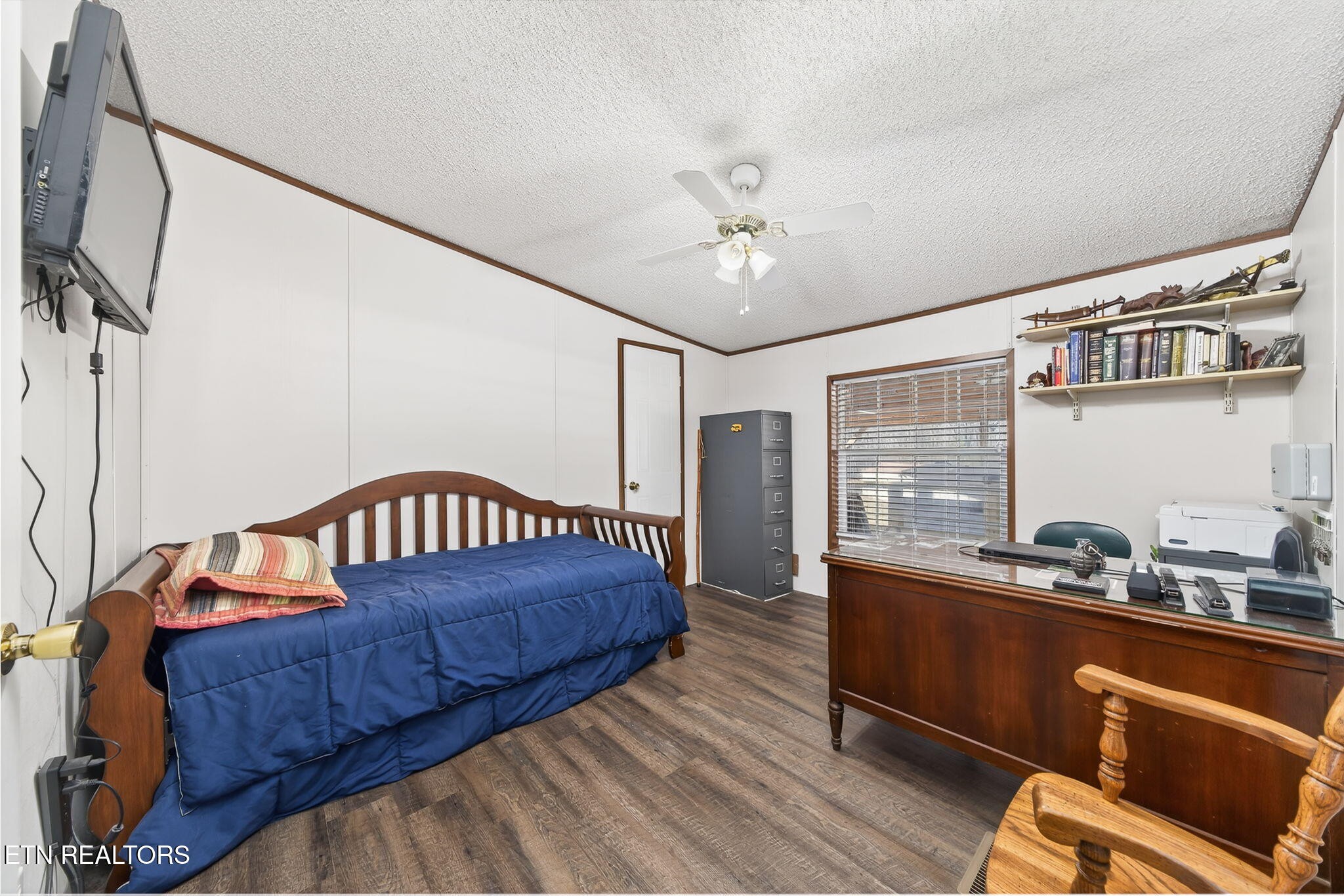 3773 Glade Creek Road Sparta, TN 38583 - Photo 23 of 59 a bedroom with a bed a dresser and potted plant on the dresser