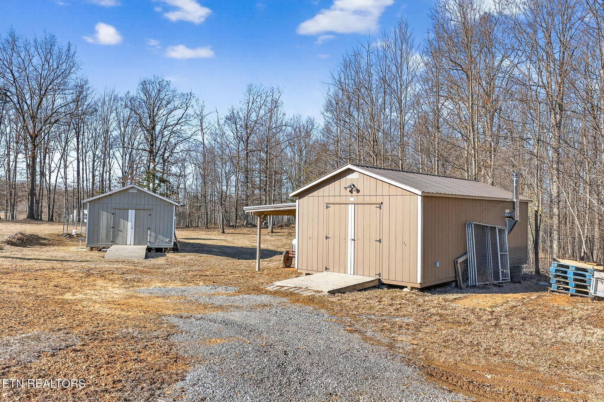 3773 Glade Creek Road Sparta, TN 38583 - Photo 35 of 59 a view of a house with a yard covered in snow