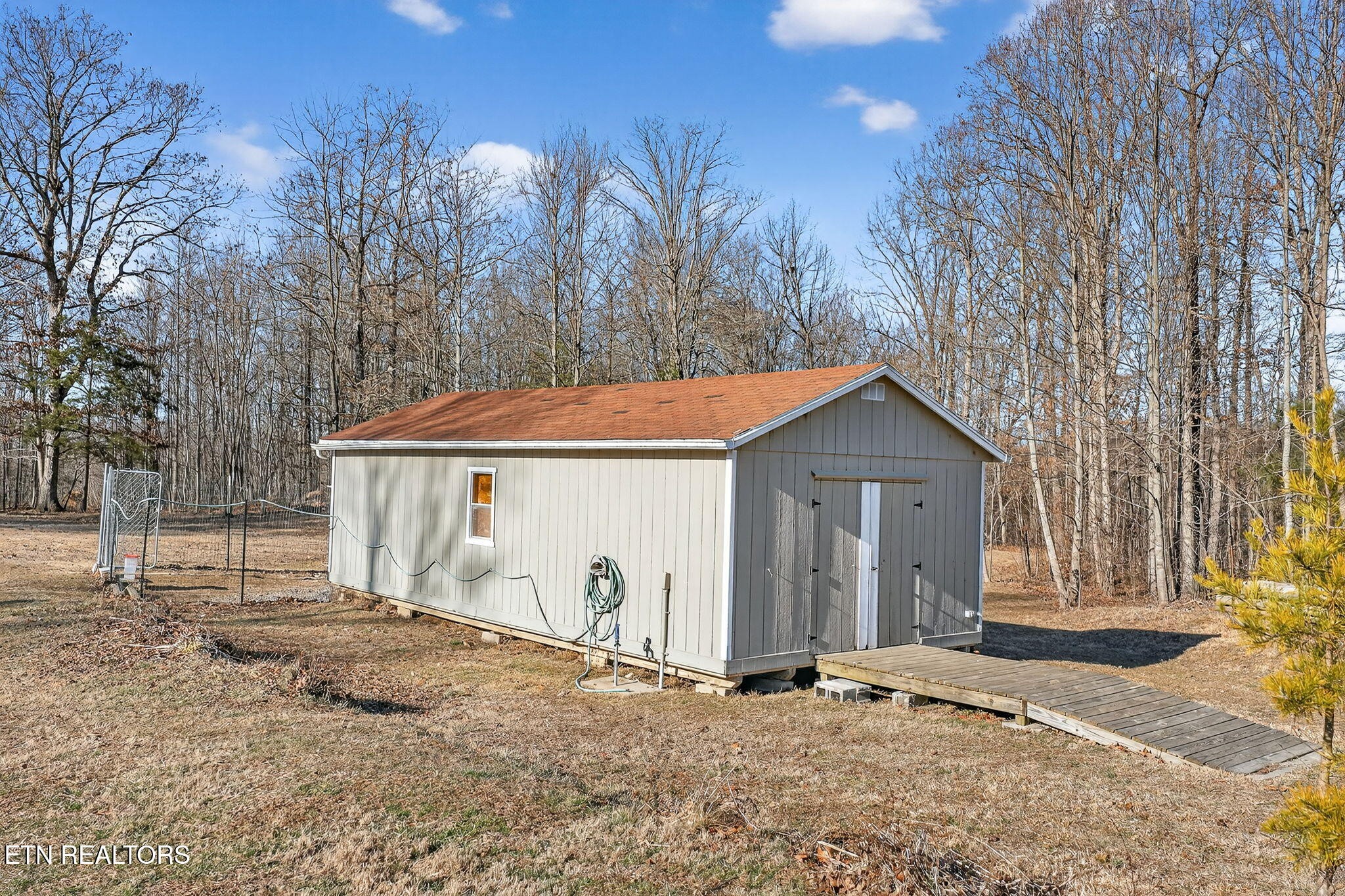 3773 Glade Creek Road Sparta, TN 38583 - Photo 37 of 59 a view of a house with a snow in the yard