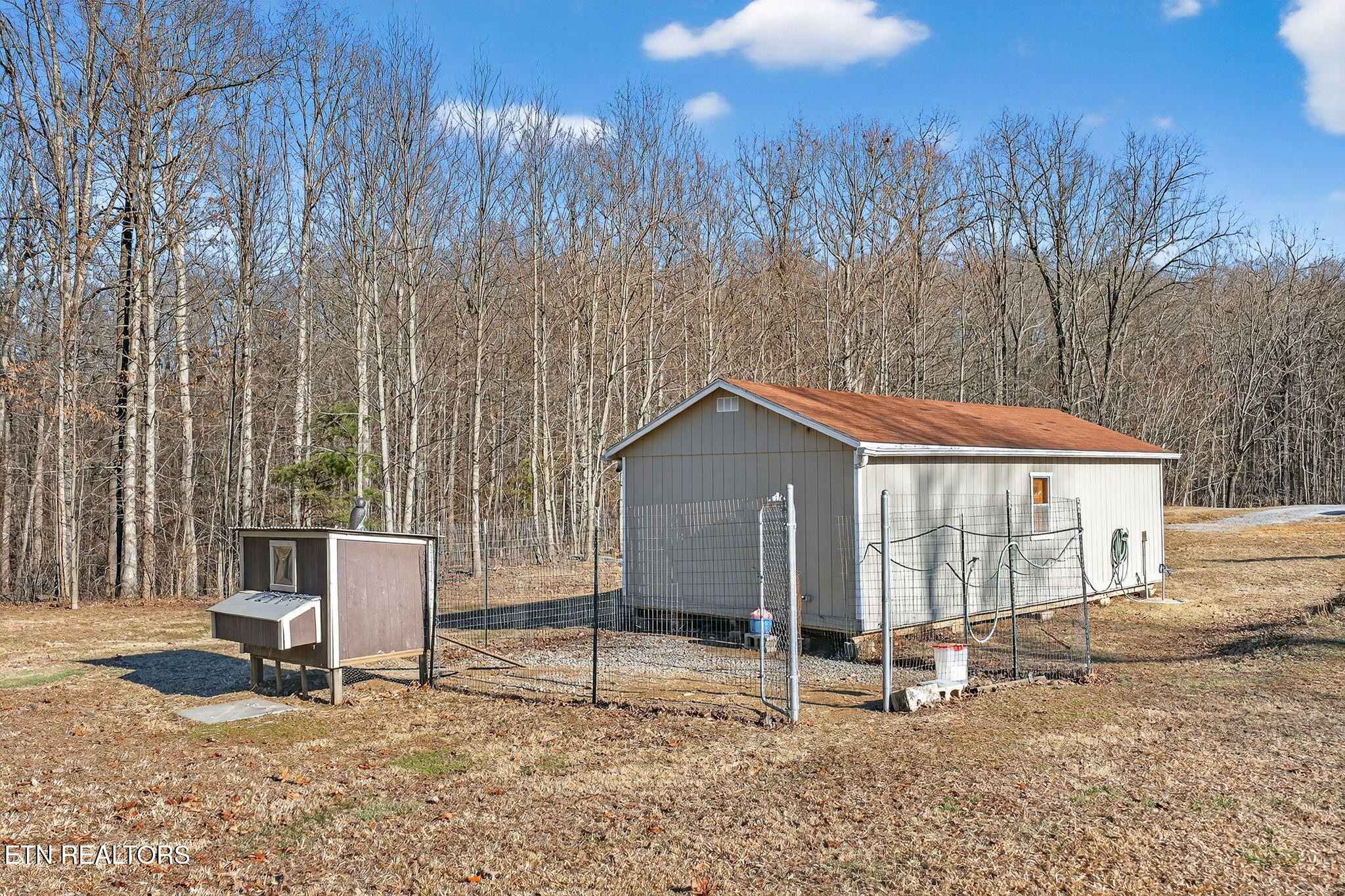 3773 Glade Creek Road Sparta, TN 38583 - Photo 39 of 59 a house with a bench in front of it