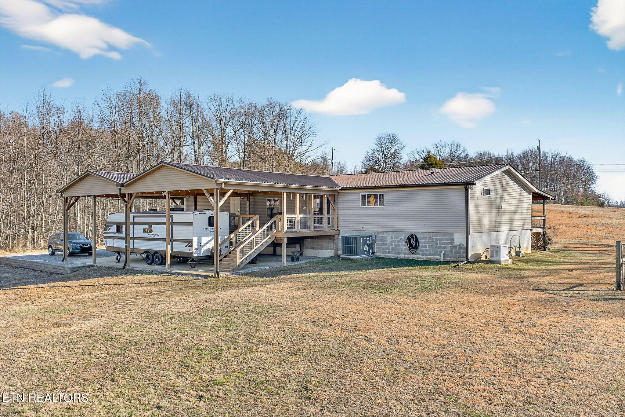 3773 Glade Creek Road Sparta, TN 38583 - Photo 48 of 59 a view of a house with a patio and a yard