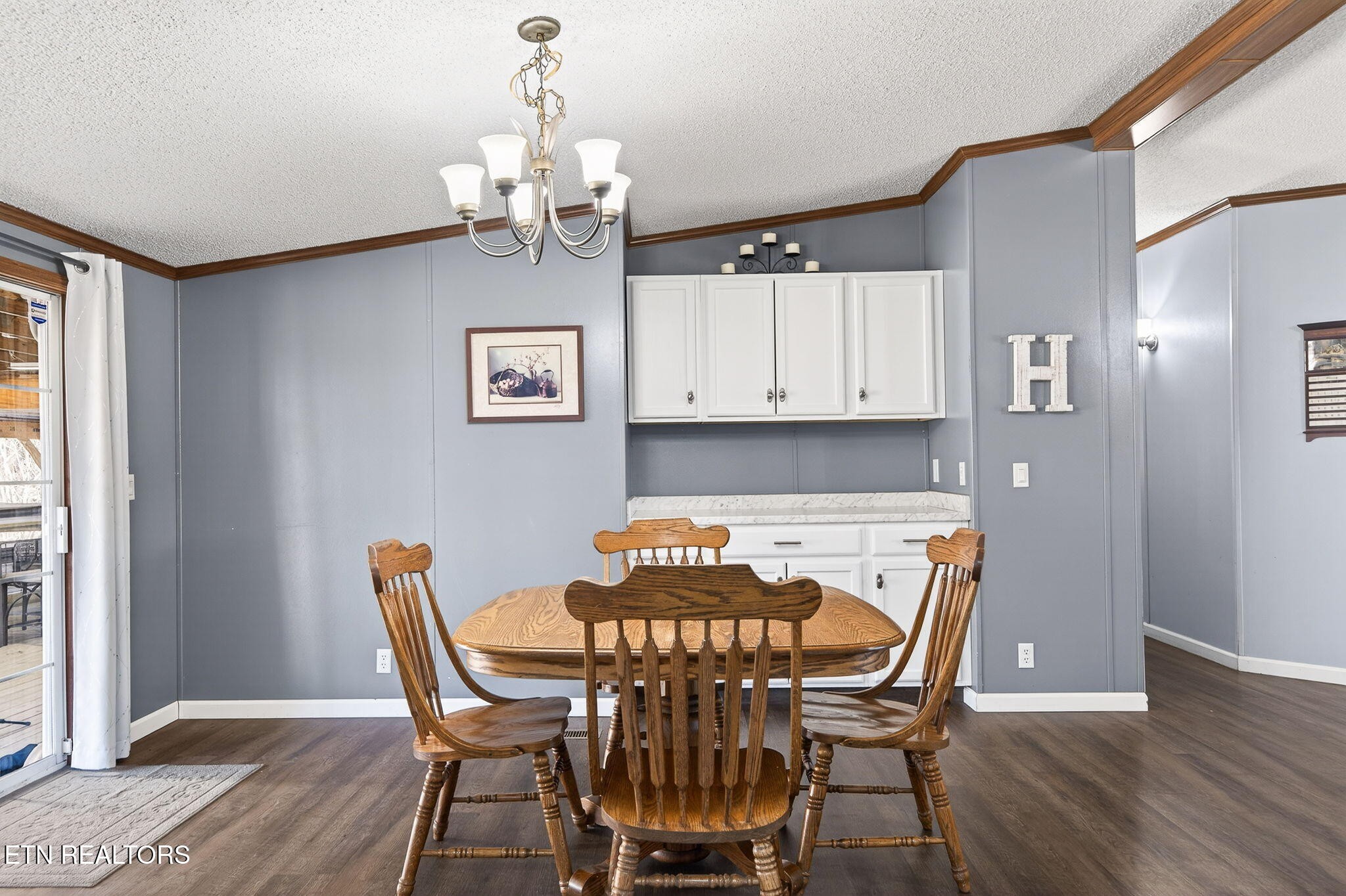 3773 Glade Creek Road Sparta, TN 38583 - Photo 8 of 59 a view of a dining room with furniture and wooden floor