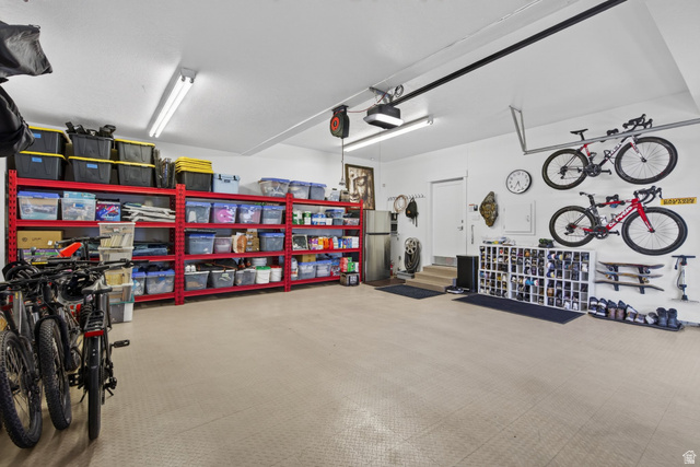 12308 Mariah Circle Draper, UT 84020 - Photo 215 of 293 Guest House Spacious garage featuring light-toned flooring, white walls, and built-in overhead lighting
