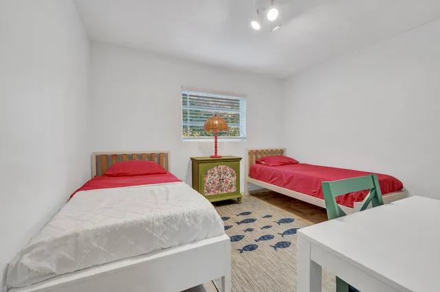 a bedroom with a bed and balcony