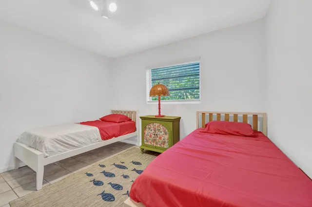 a bedroom with a bed and a chair