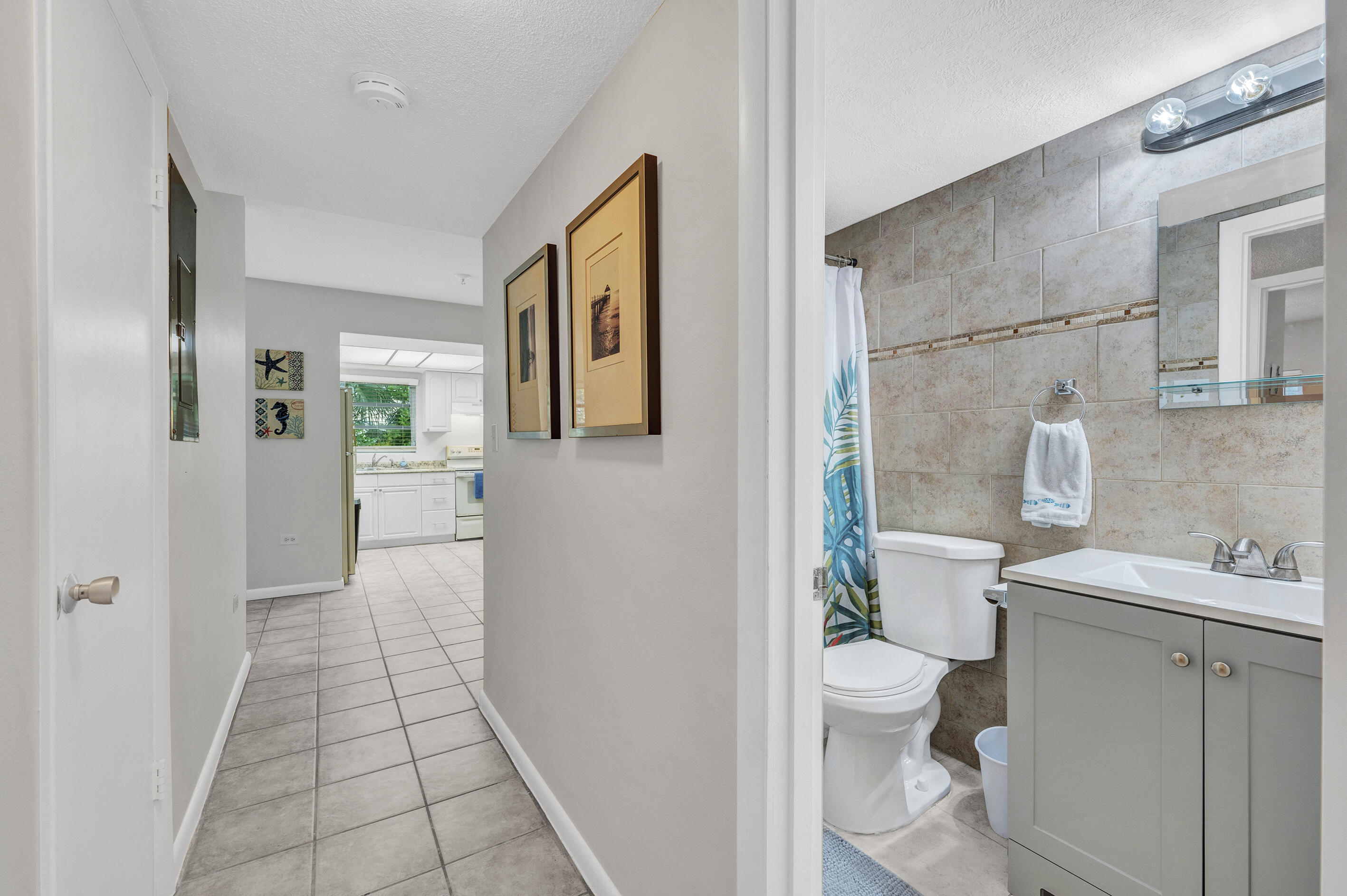 1129 Pebble Beach Lane, Unit 6 Marathon, FL 33050 - Photo 14 of 31 a bathroom with a sink a toilet and shower