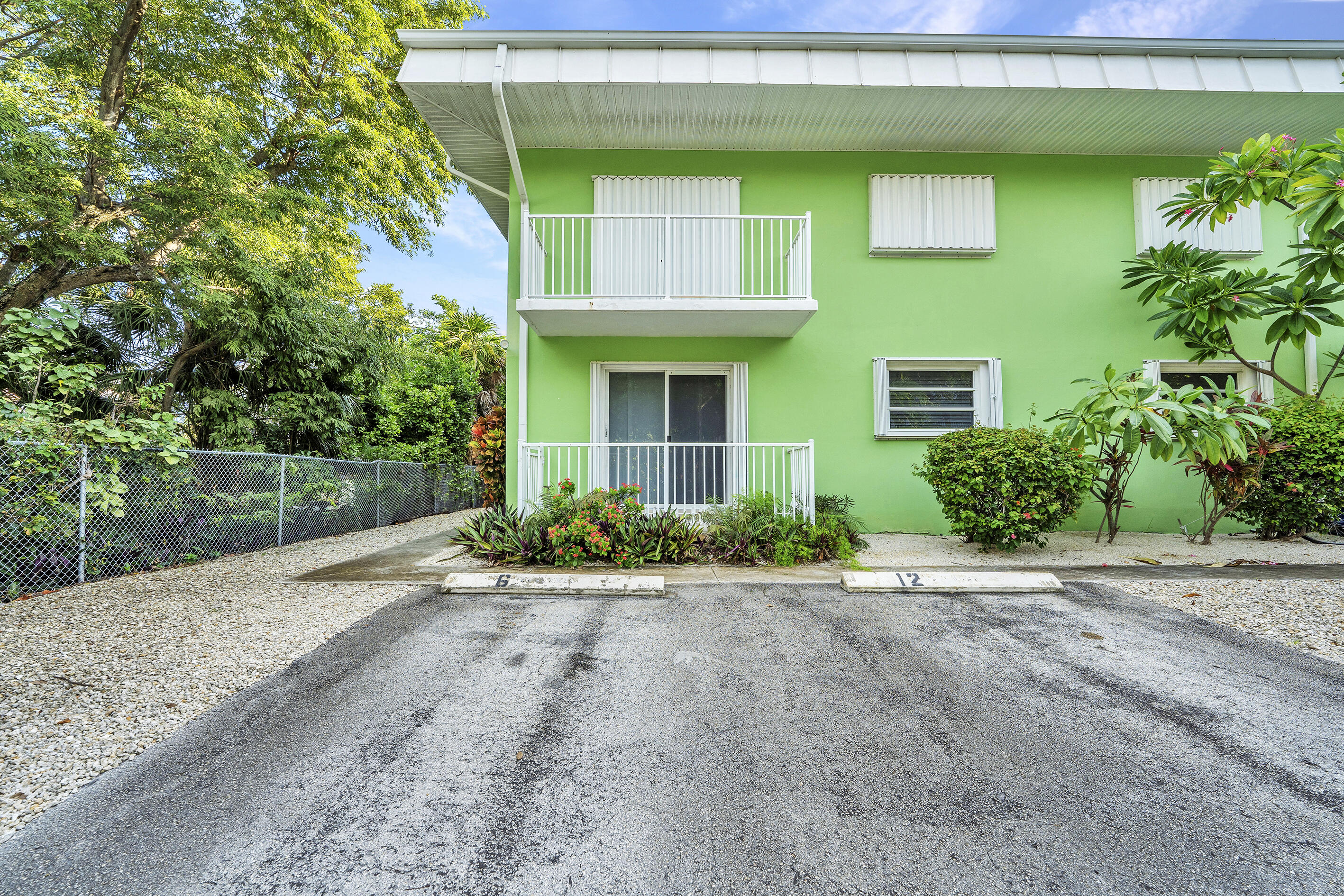 1129 Pebble Beach Lane, Unit 6 Marathon, FL 33050 - Photo 23 of 31 a front view of a house with a yard