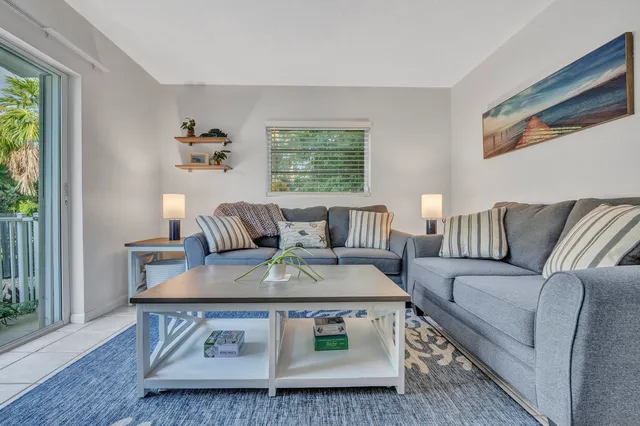 a living room with furniture and a window