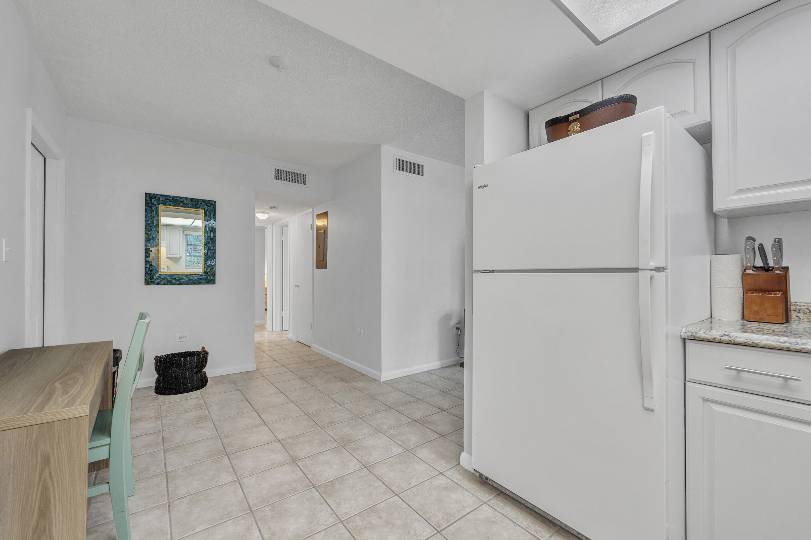 1129 Pebble Beach Lane, Unit 6 Marathon, FL 33050 - Photo 9 of 31 a white refrigerator freezer sitting in a kitchen