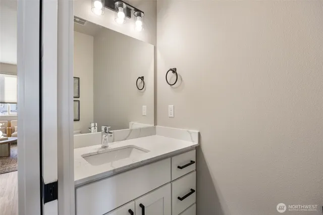 a bathroom with a sink and a mirror