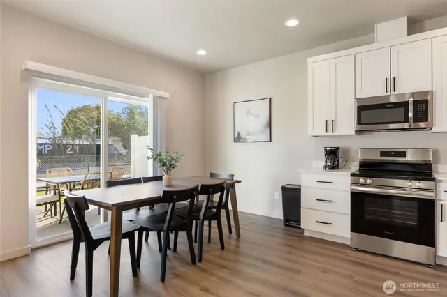 a view of a dining room with furniture window and wooden floor