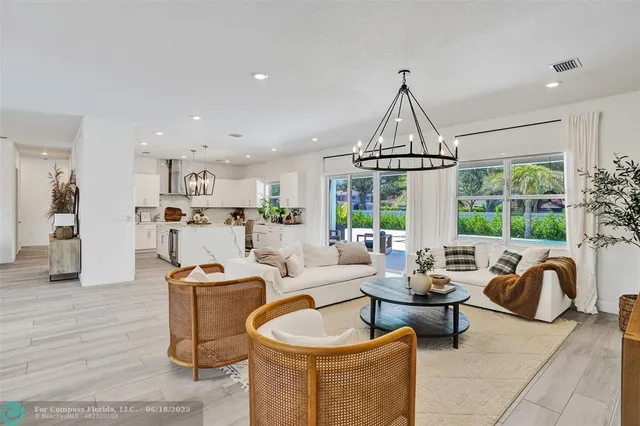 a living room with furniture a fireplace and a table