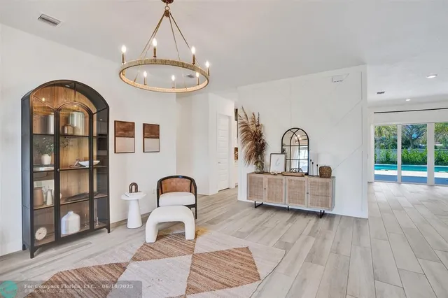 a view of living room with furniture and window