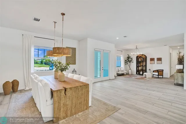a view of living room kitchen with furniture and floor to ceiling window