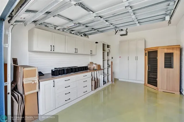 a kitchen with granite countertop a stove and a refrigerator
