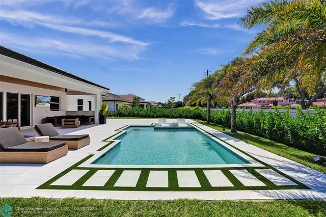 a view of a house with swimming pool