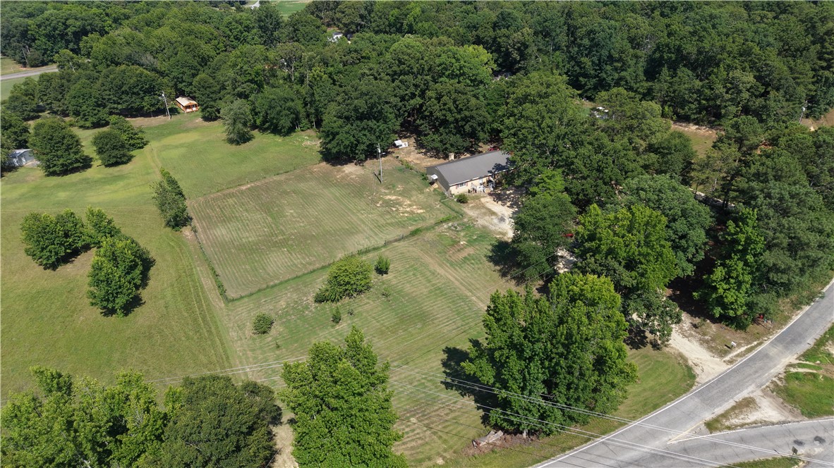 101 Due West Road Belton, SC 29627 - Photo 2 of 22 Nestled among a verdant landscape, discover this private home with ample outdoor space and mature trees.