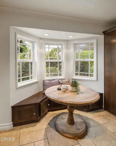 a living room with furniture wooden floor and a fireplace