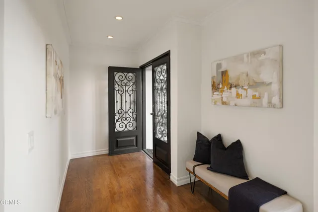 a living room with furniture and a closet