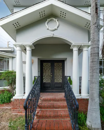 a front view of a house with garden